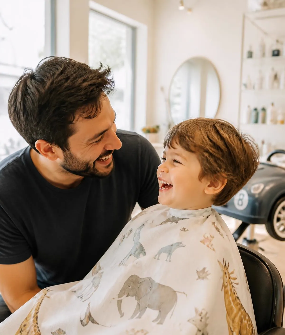 A parent and child laughing together during a salon visit