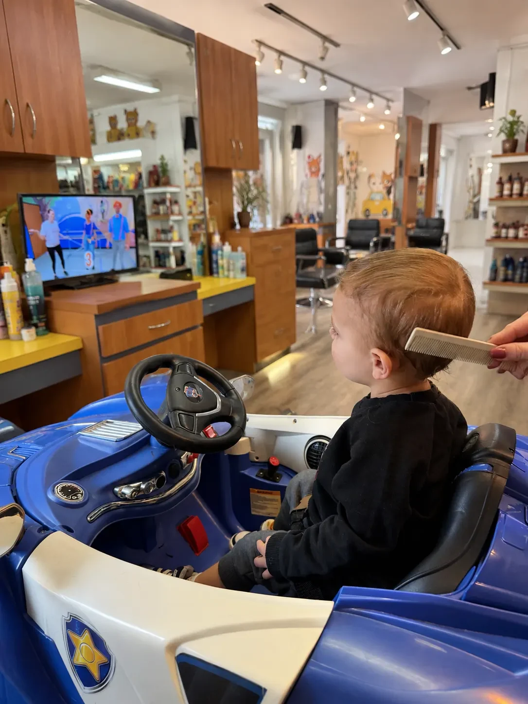 Cartoons playing while the haircut happens